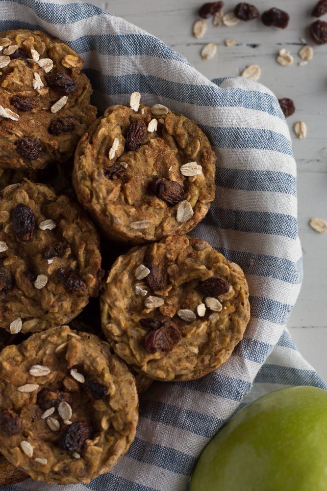 Apple Acorn Squash Muffins on blue and white striped towel by Flora & Vino