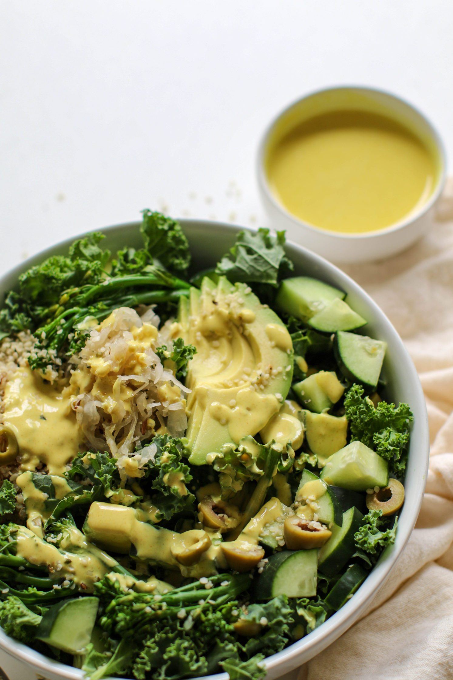 Green Macro Bowl served in a bowl with Turmeric Tahini by Flora & Vino