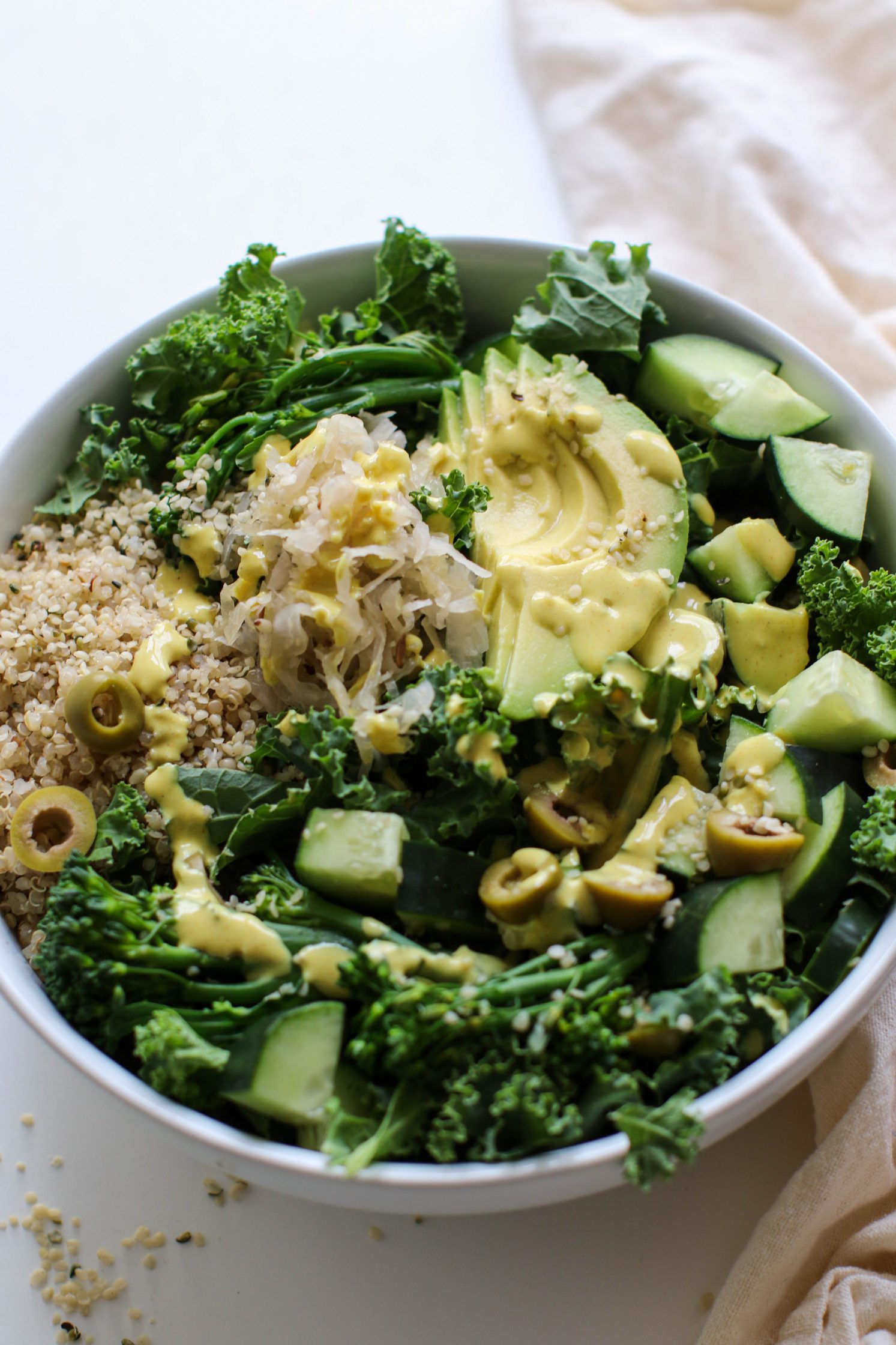 Green Macro Bowl served in a bowl with Turmeric Tahini by Flora & Vino
