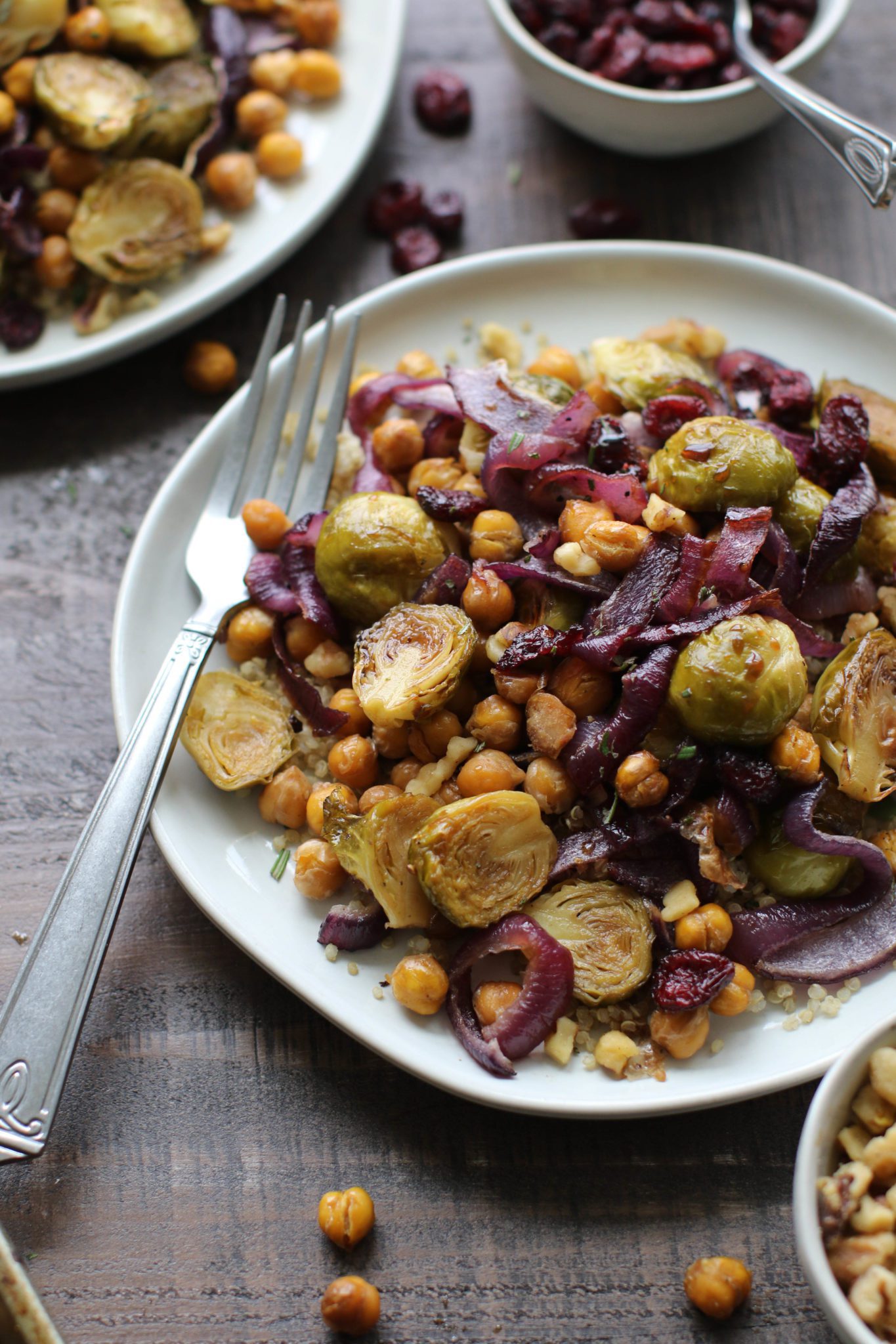 Maple Balsamic Brussels Sprouts & Chickpeas served on plates with fork by Flora & Vino