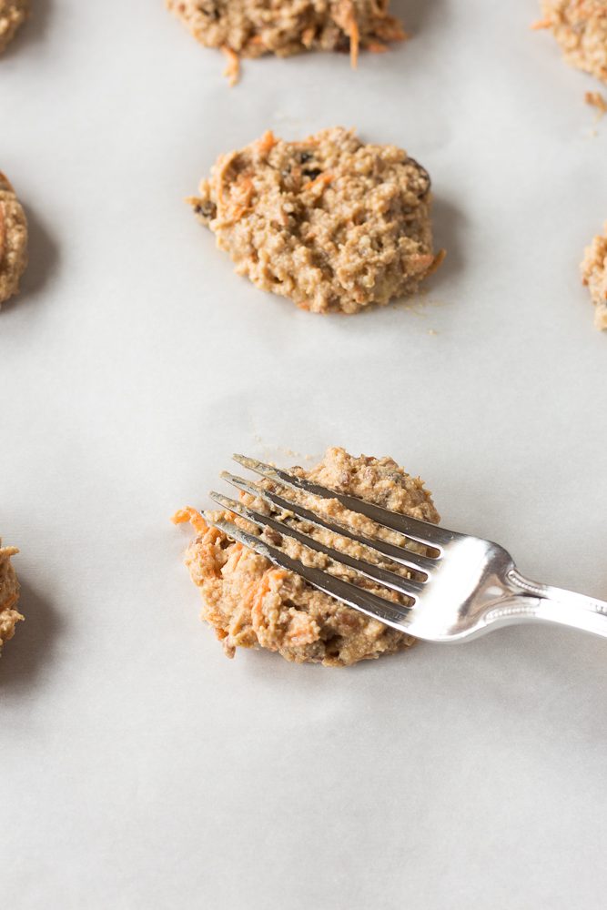 Quinoa Carrot Cake Breakfast Cookie batter smashed down with fork