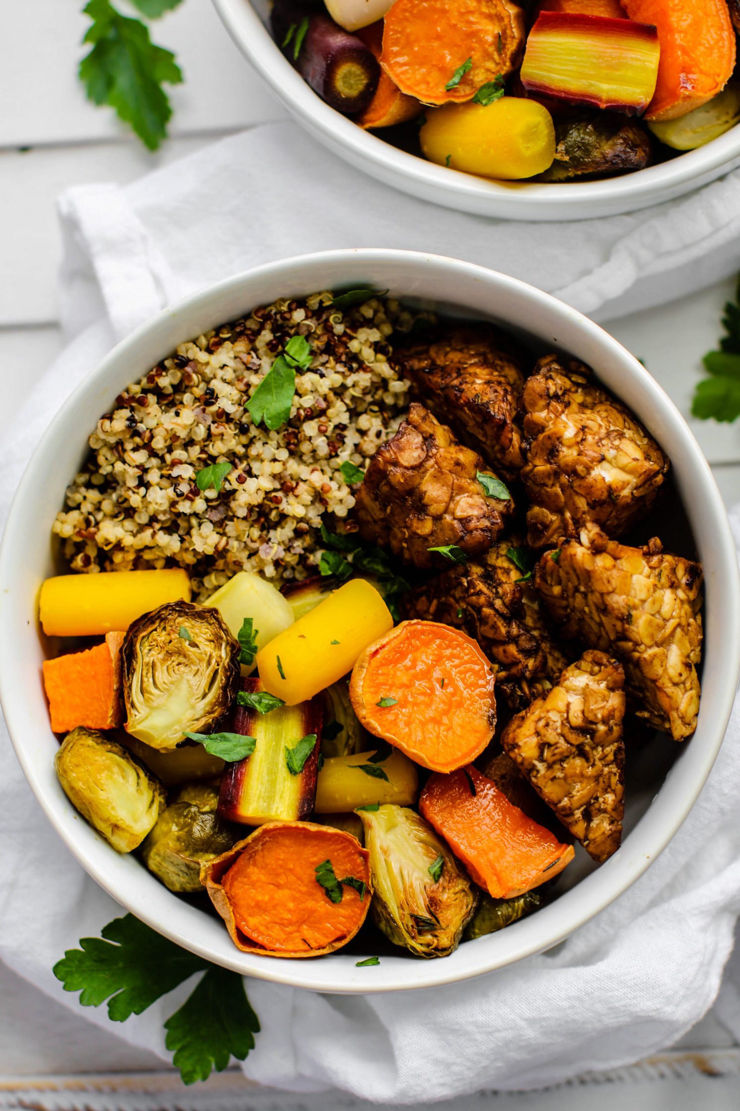 Maple Balsamic Tempeh Bowls served in bowls with rainbow veggies and parsley