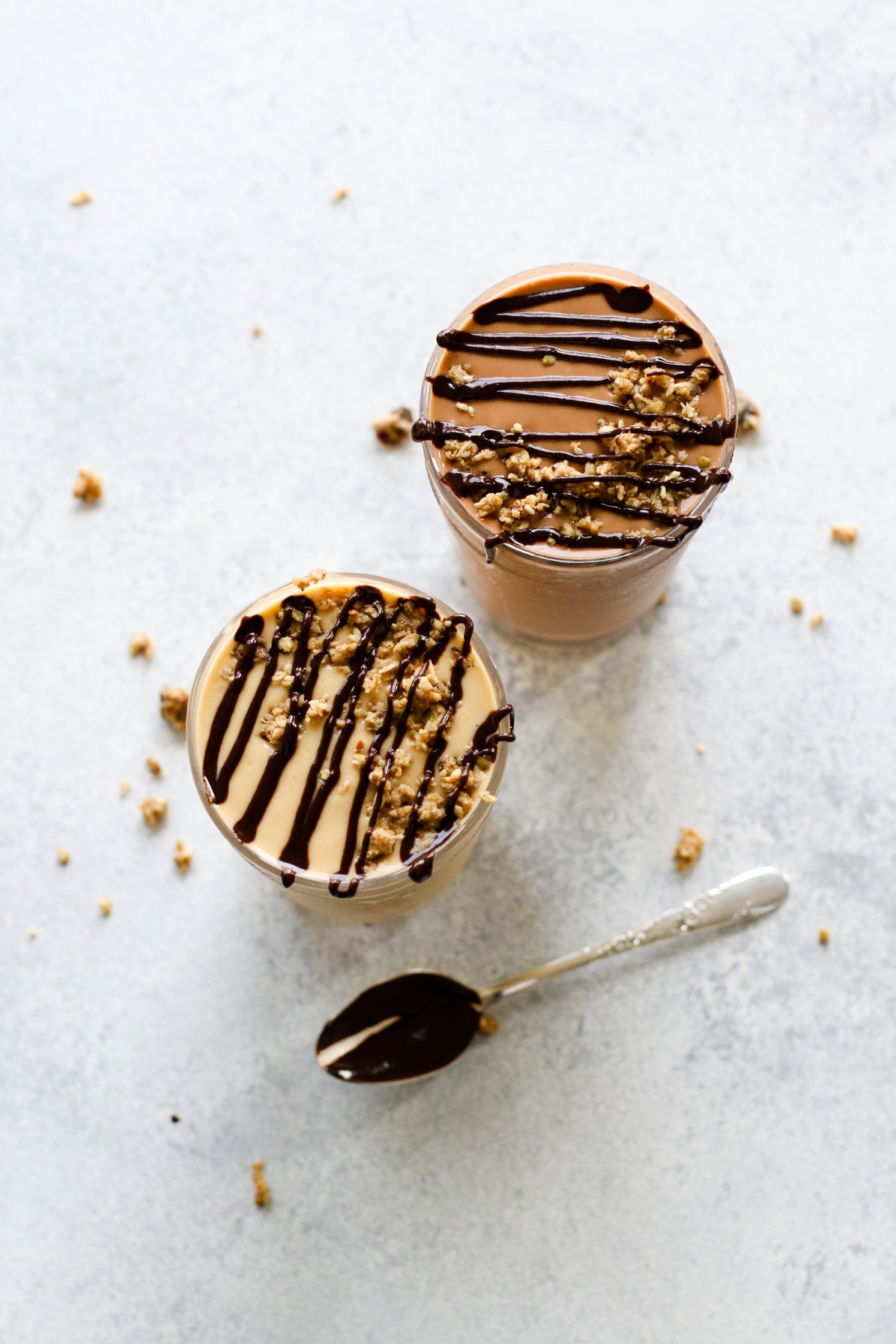 Fruit-Free "Fake Out" Shakes served in tall glasses topped with chocolate tahini and granola crumble by Flora & Vino