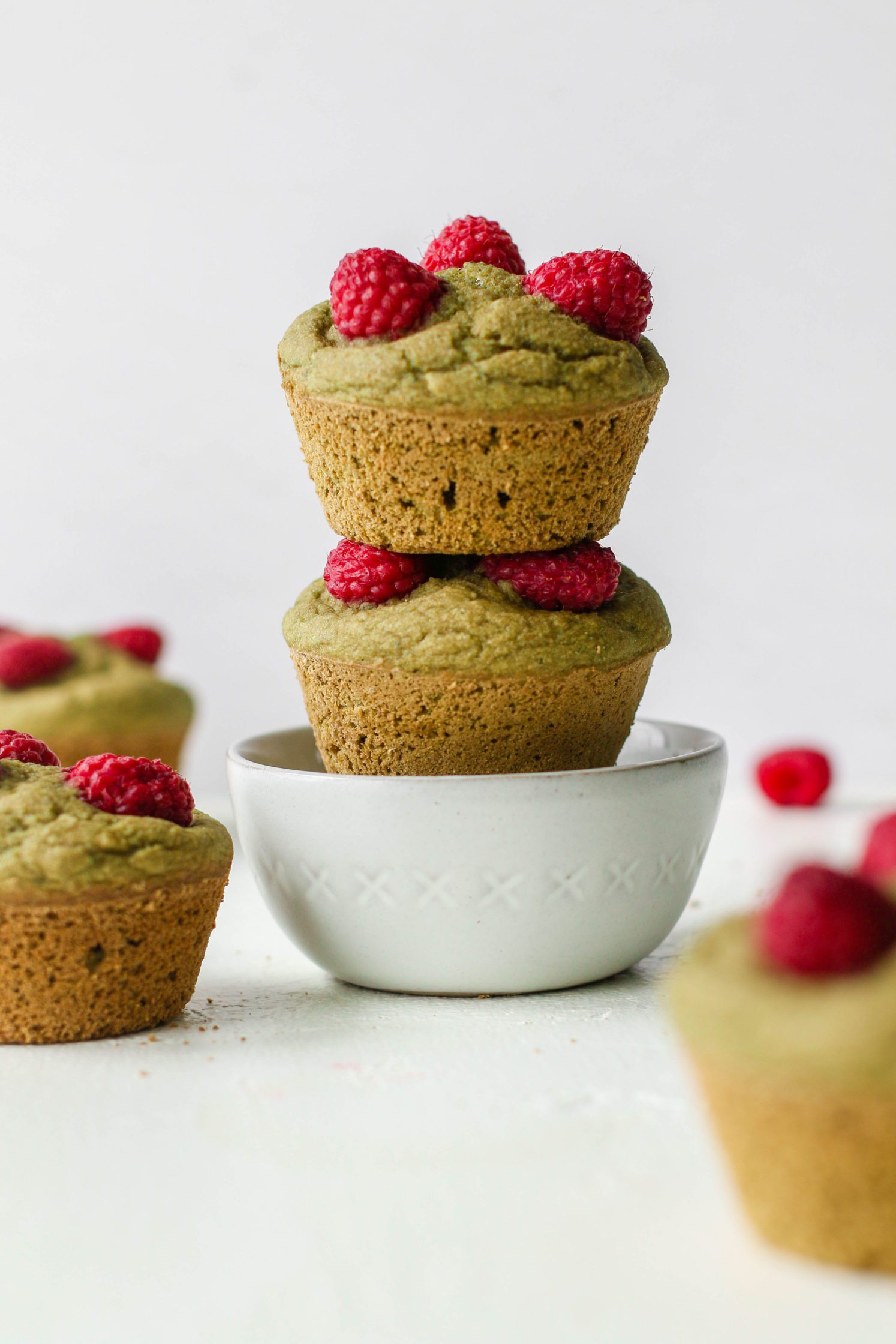 Raspberry Matcha Muffins stacked in bowl by Flora & Vino