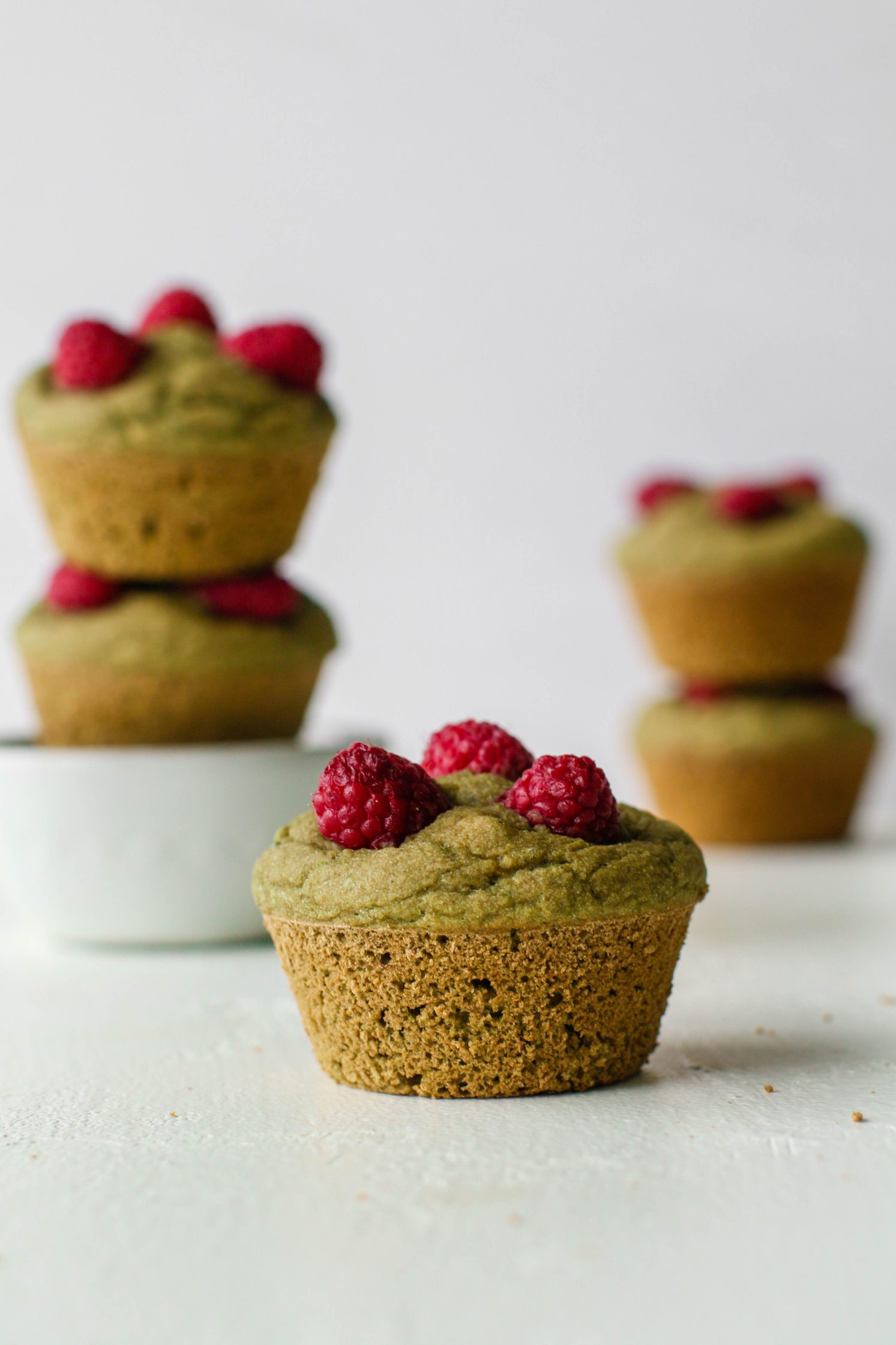 Raspberry Matcha Muffins stacked by Flora & Vino
