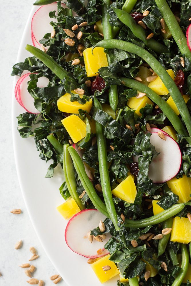 Golden Beet & Green Bean Salad served on platter with forks and tahini dressing 