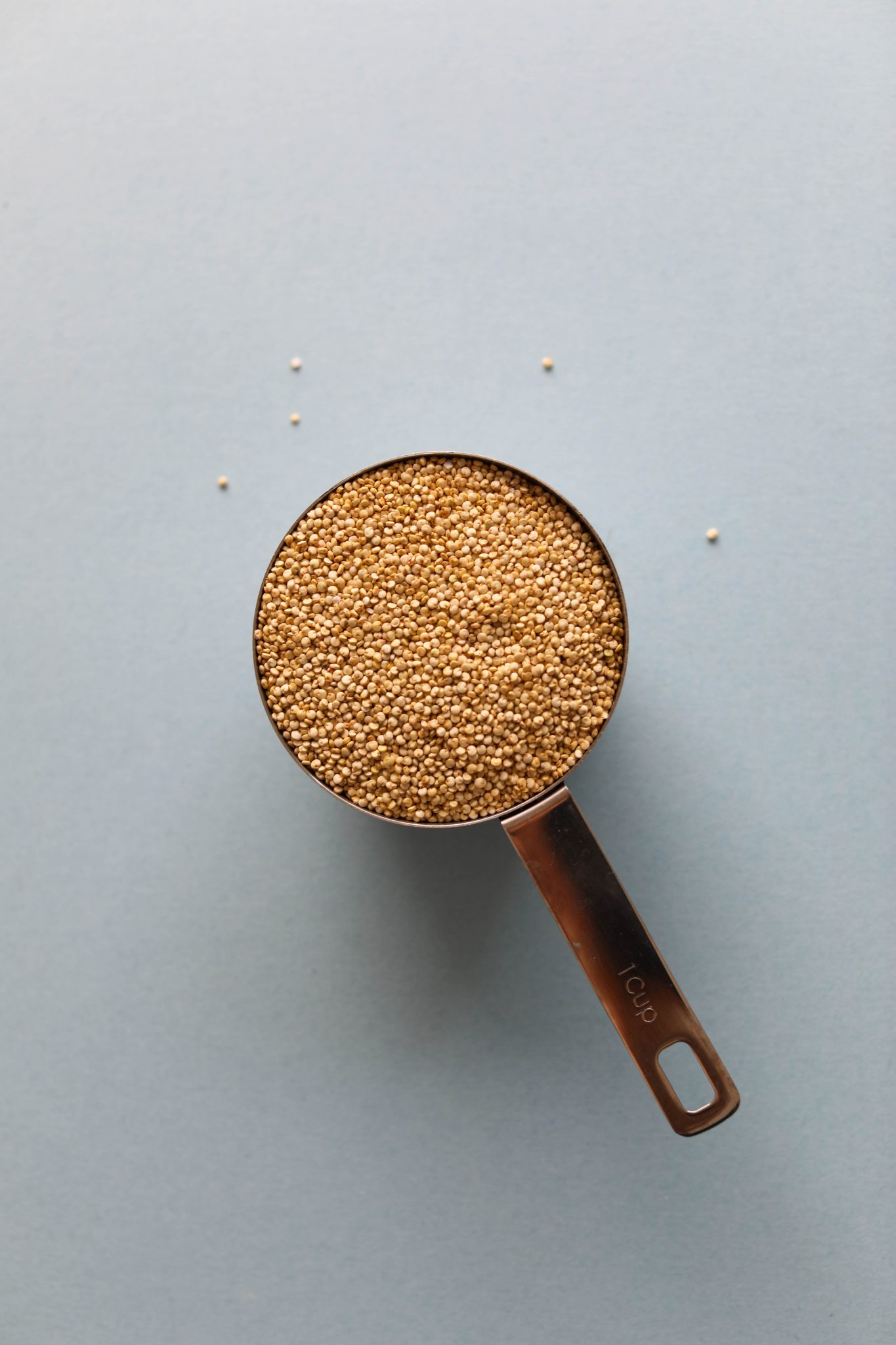 uncooked quinoa dry in measuring cup