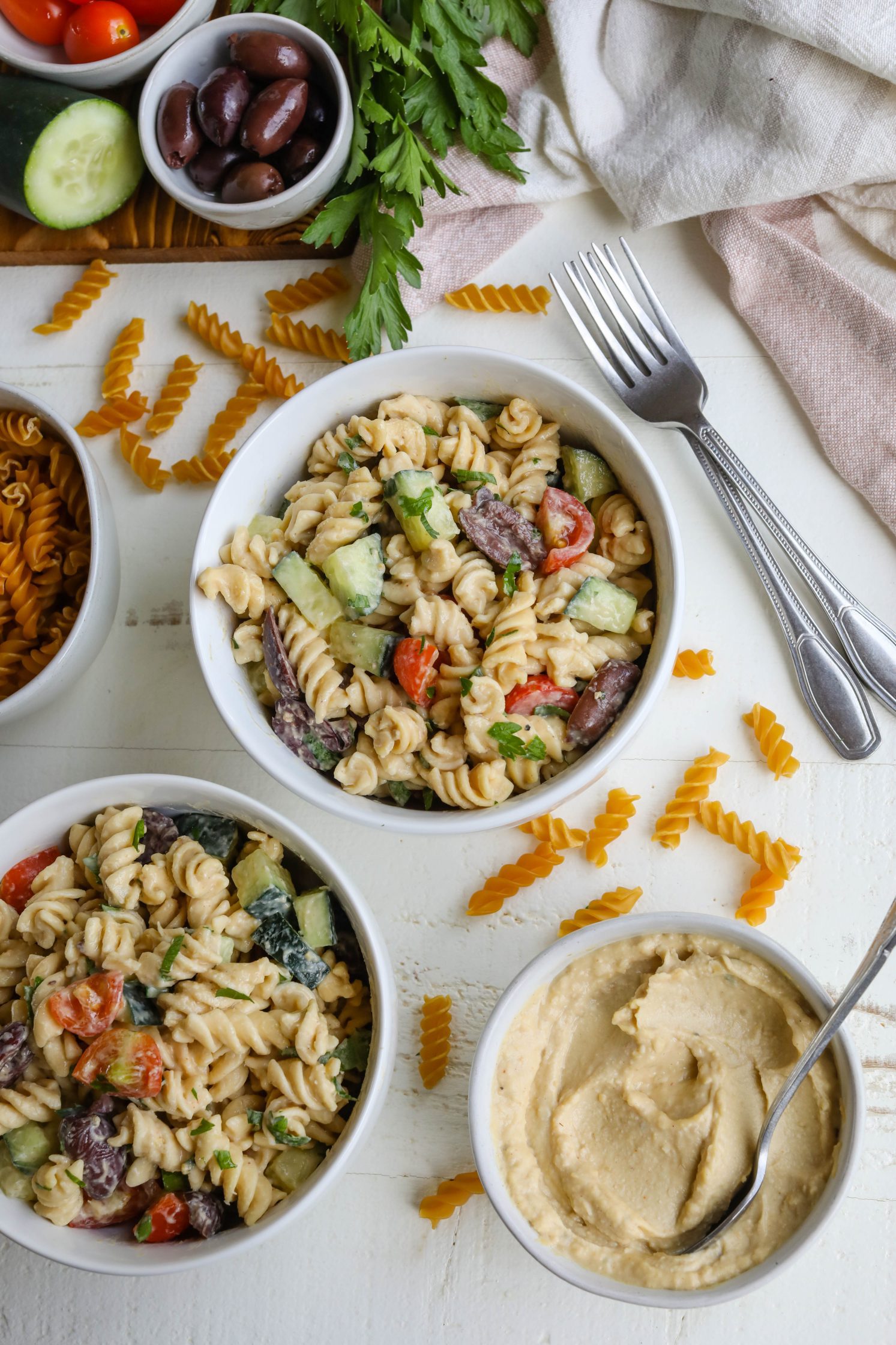 Easy Hummus Pasta Salad served in bowls by Flora & Vino