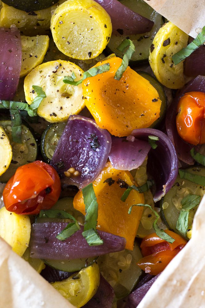 Oven Roasted Summer Vegetables in parchment paper roasting bag topped with fresh herbs