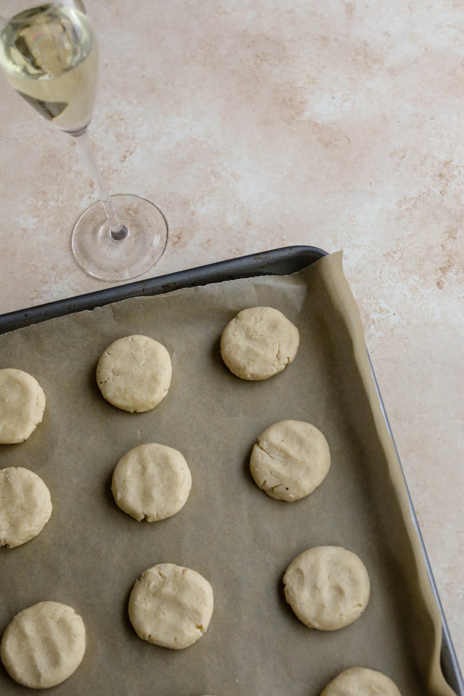 Vegan Shortbread Cookies on parchment lined baking sheet by Flora & Vino