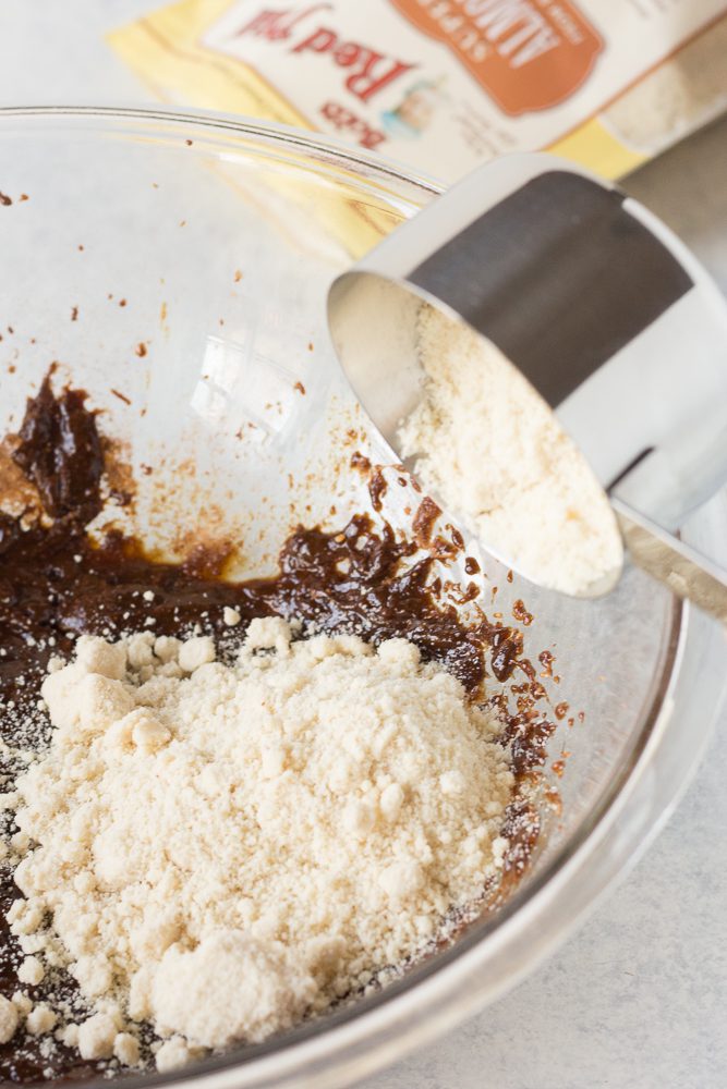 flour added to gingerbread cookie dough batter by Flora & Vino 