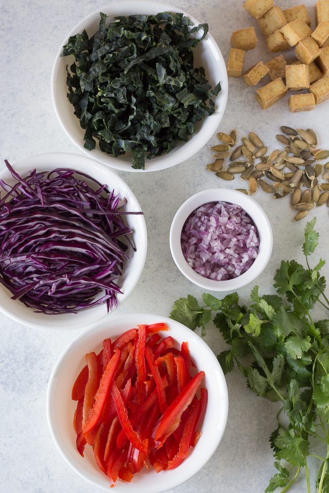 kale, red cabbage, bell pepper, red onion, baked tofu, pepitas, and cilantro by Flora & Vino