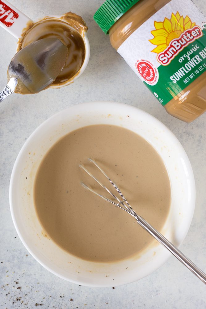 SunButter Dressing whisked in a bowl by Flora & Vino