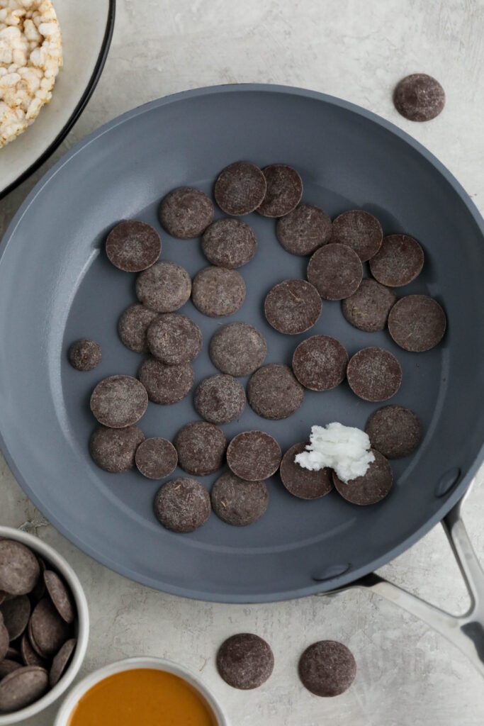 cacao wafers in green pan with coconut oil