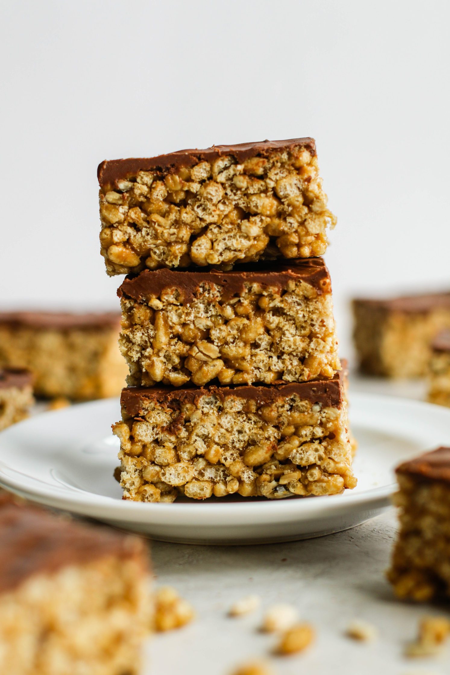 Chocolate SunButter Rice Crispy Treats stacked on plate