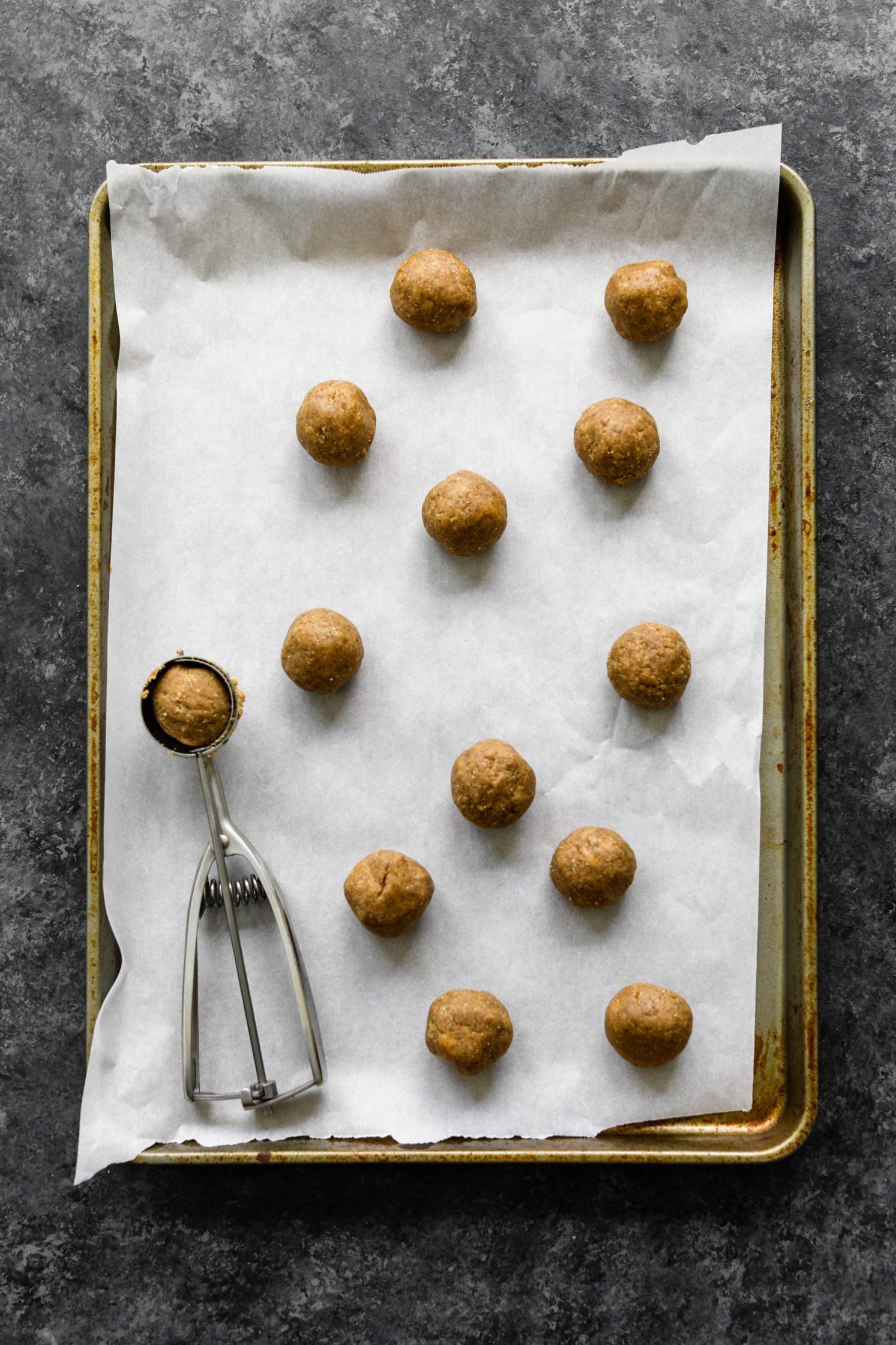 truffles rolled on parchment lined baking sheets