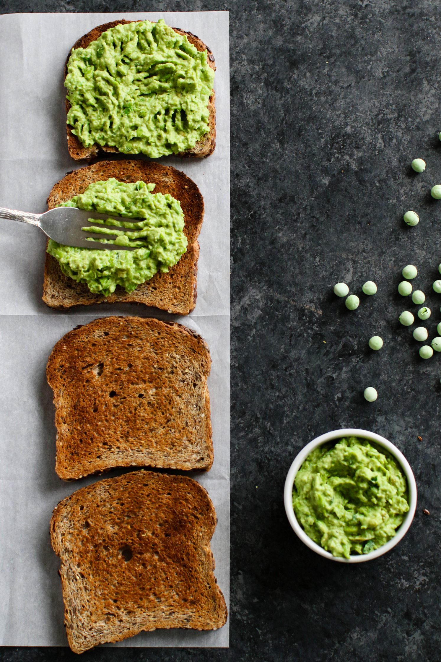 Lemon-y Smashed Pea spread smashed on toasted bread