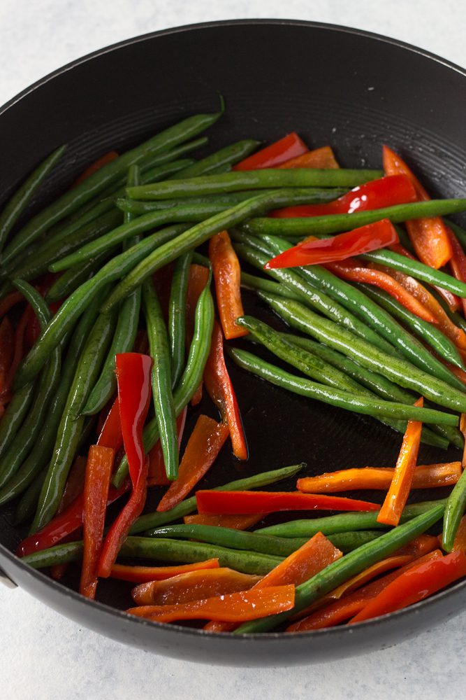 green beans and bell pepper in pan