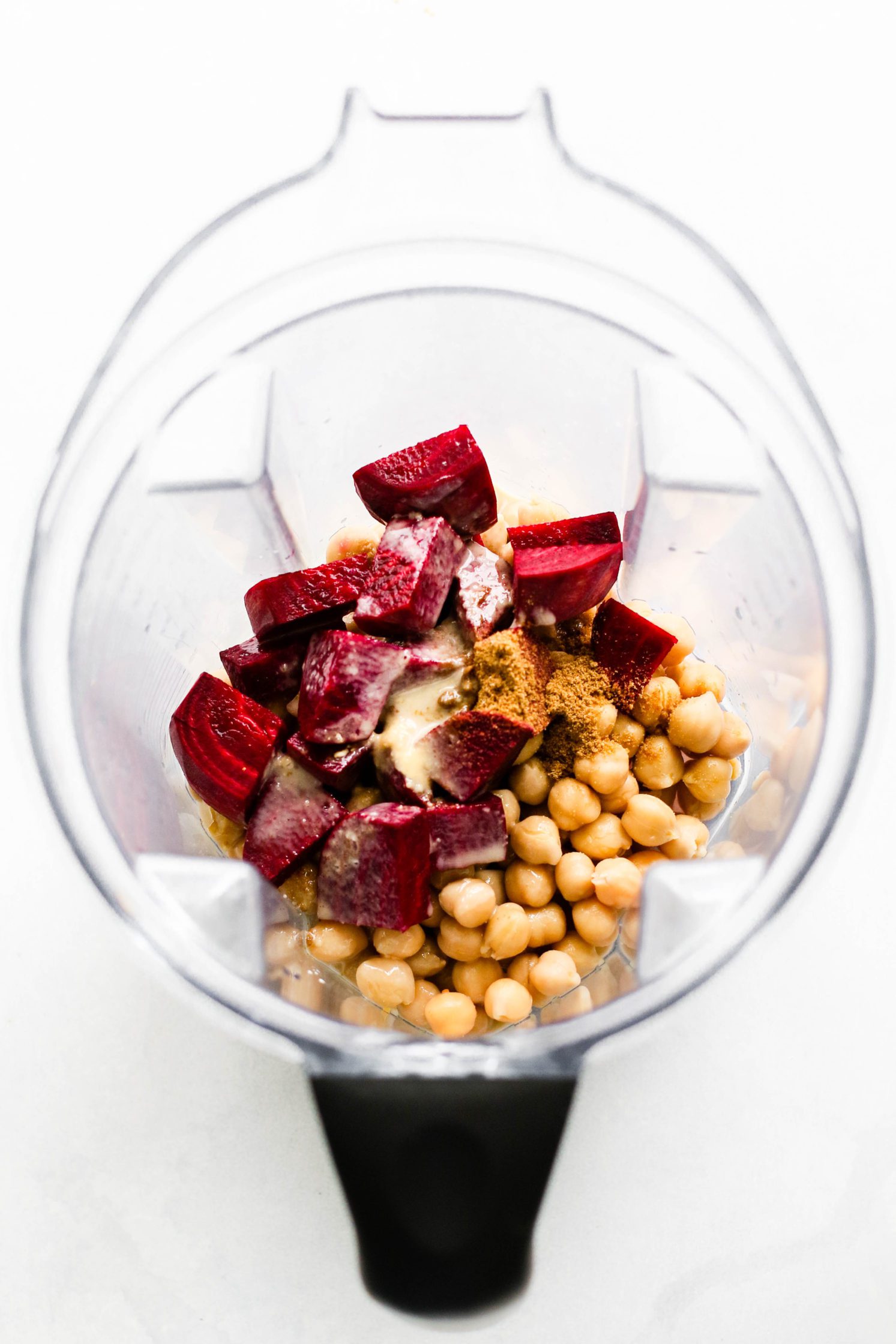 hummus ingredients in Vitamix blender with raw beets by Flora & Vino