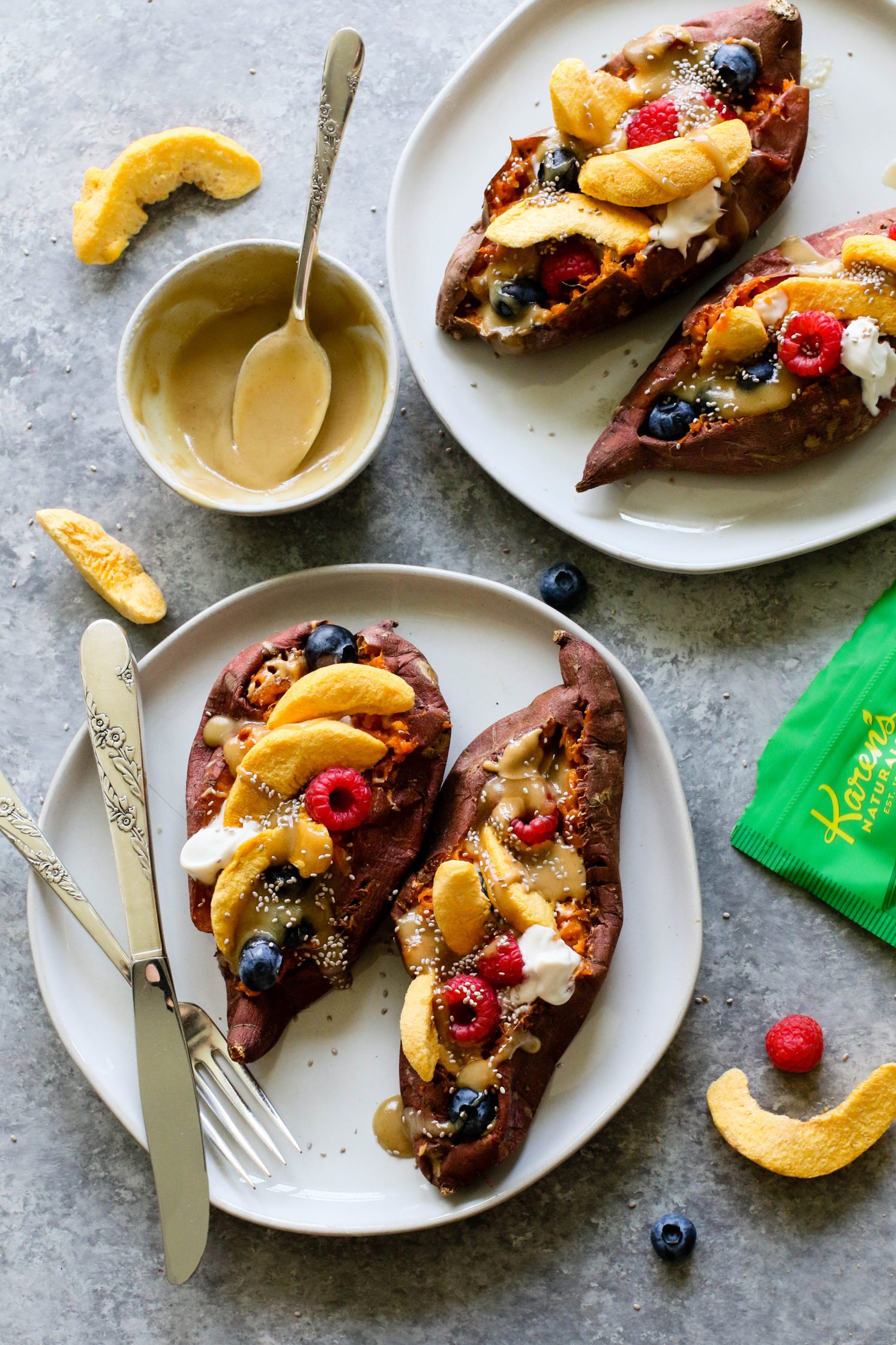 Stone Fruit Stuffed Sweet Potatoes served on plates topped with Maple Tahini