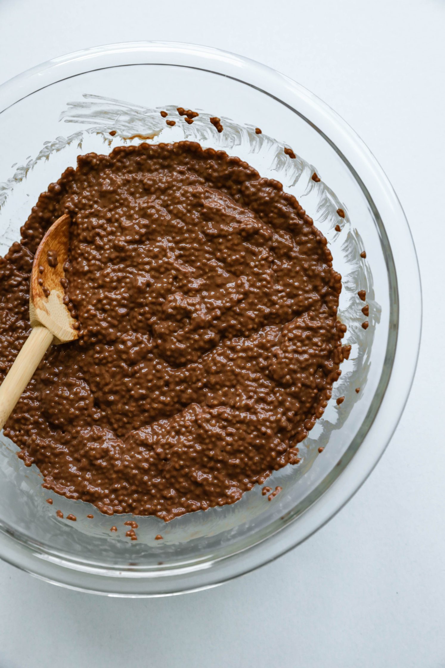 Dark Chocolate Chia Pudding in glass bowl with wooden spoon