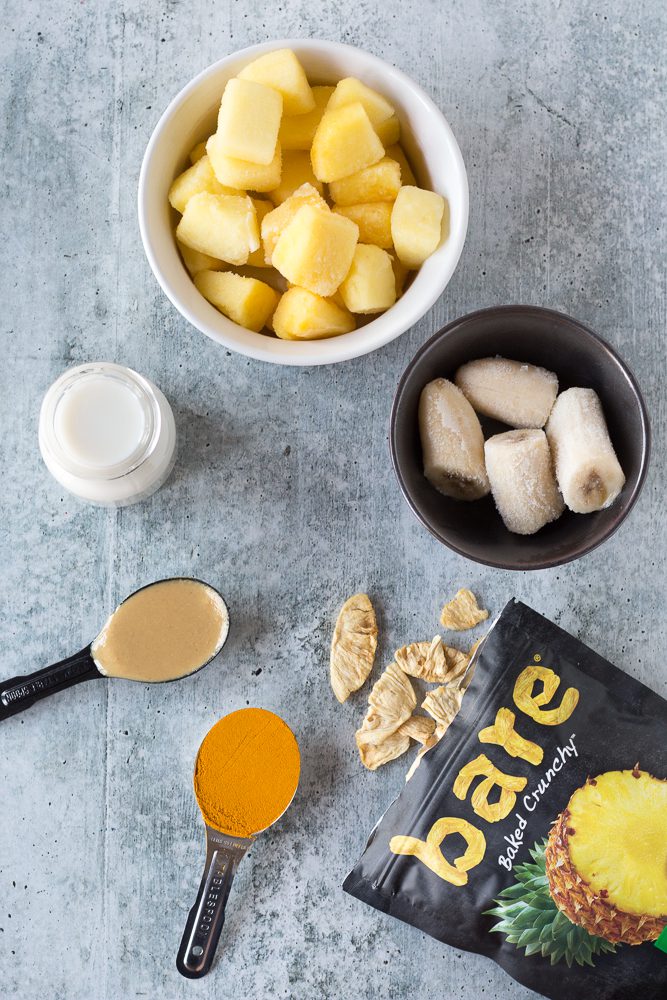 Pineapple Turmeric Tahini Shake ingredients on board by Flora & Vino