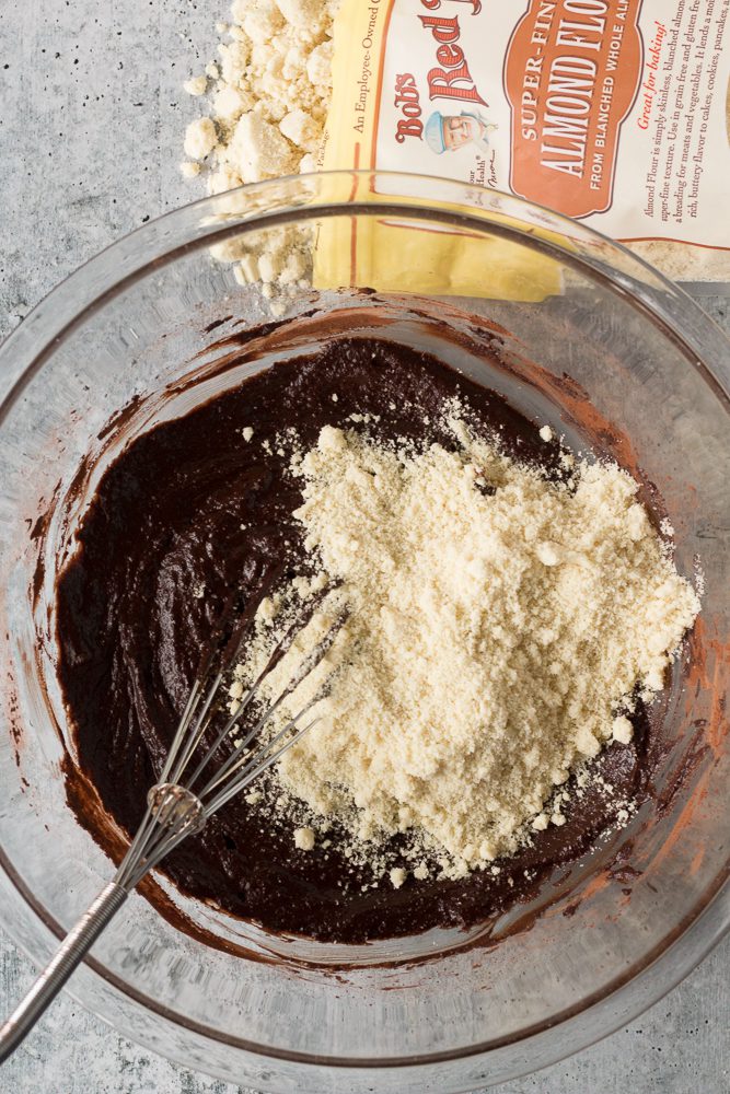 pumpkin brownies mixed with almond flour in glass bowl