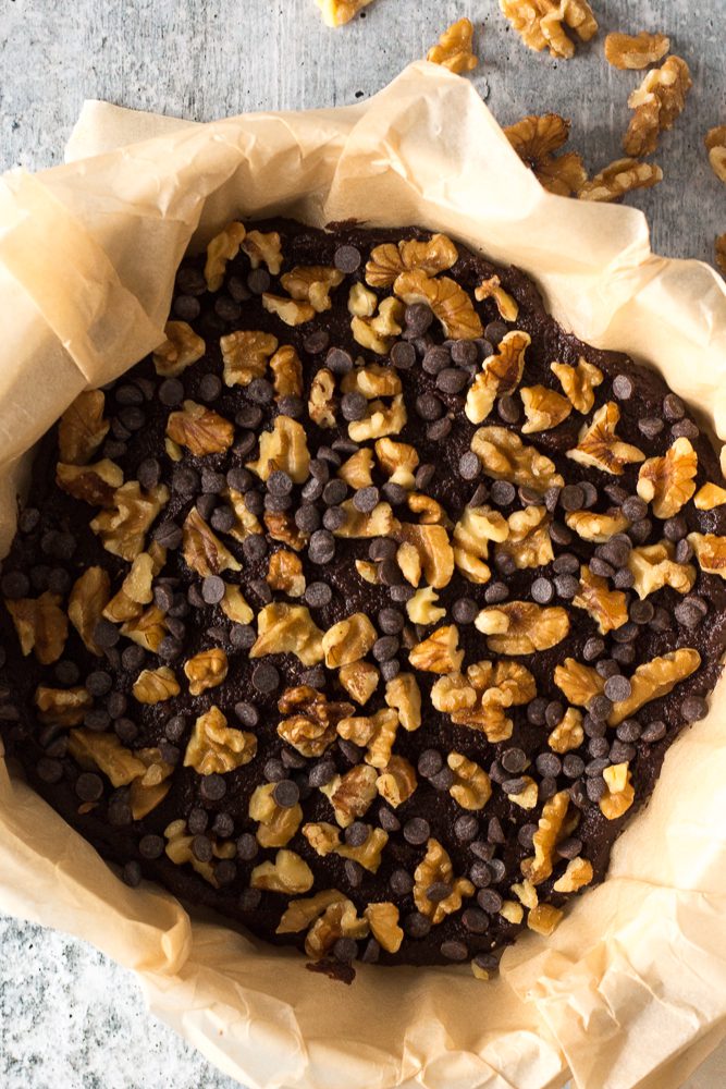 Pumpkin Almond Butter Brownies baked with walnuts and chocolate chips by Flora & Vino