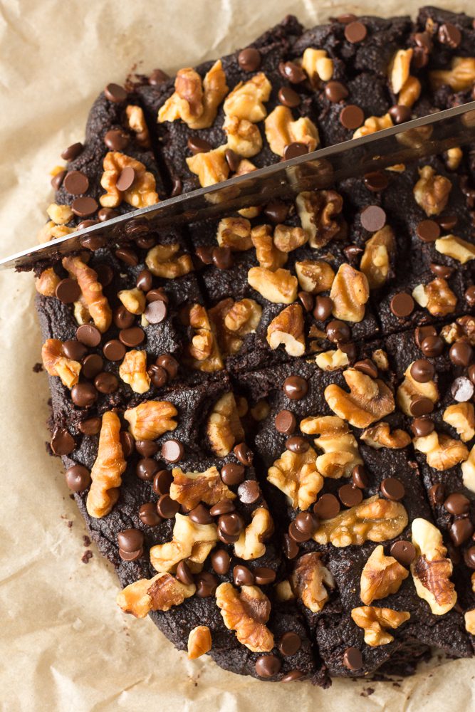 Pumpkin Almond Butter Brownies sliced with knife by Flora & Vino