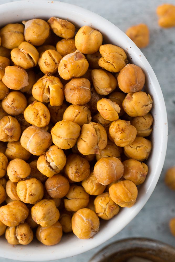 Oil-Free Roasted Spiced Chickpeas served in a bowl by Flora & Vino