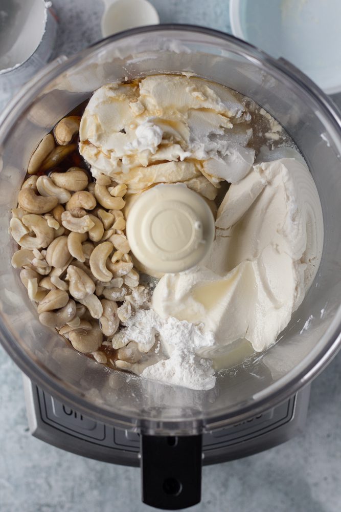 cheesecake filling ingredients in food processor by Flora & Vino