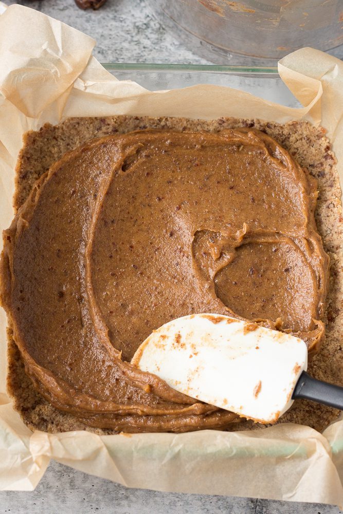 date caramel spread on top of vegan nougat in baking dish by Flora & Vino