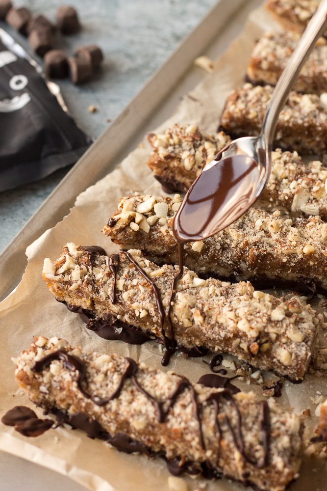 chocolate drizzled on date caramel nougat bars by Flora & Vino