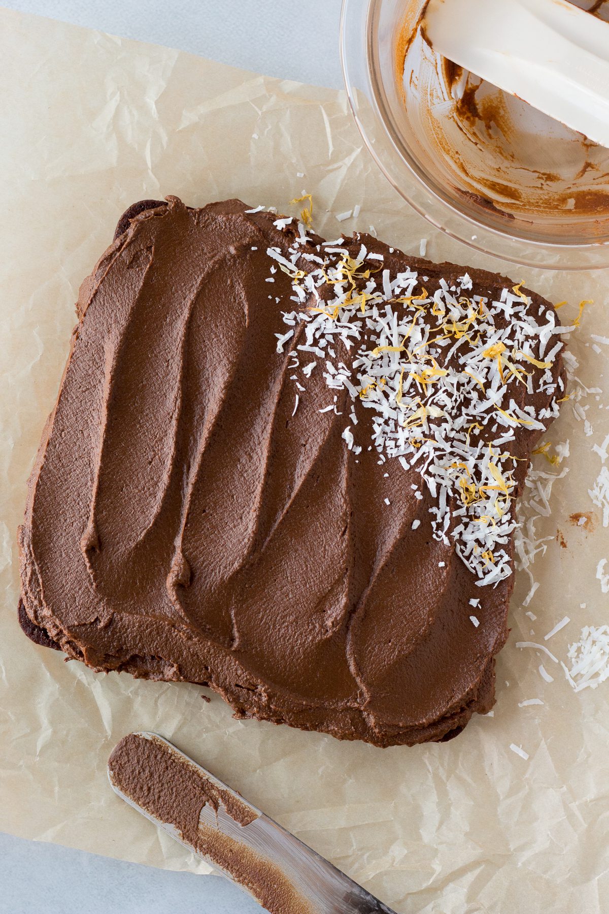 Vegan Chocolate Cake frosted with Sweet Potato Frosting and topped with shredded coconut 