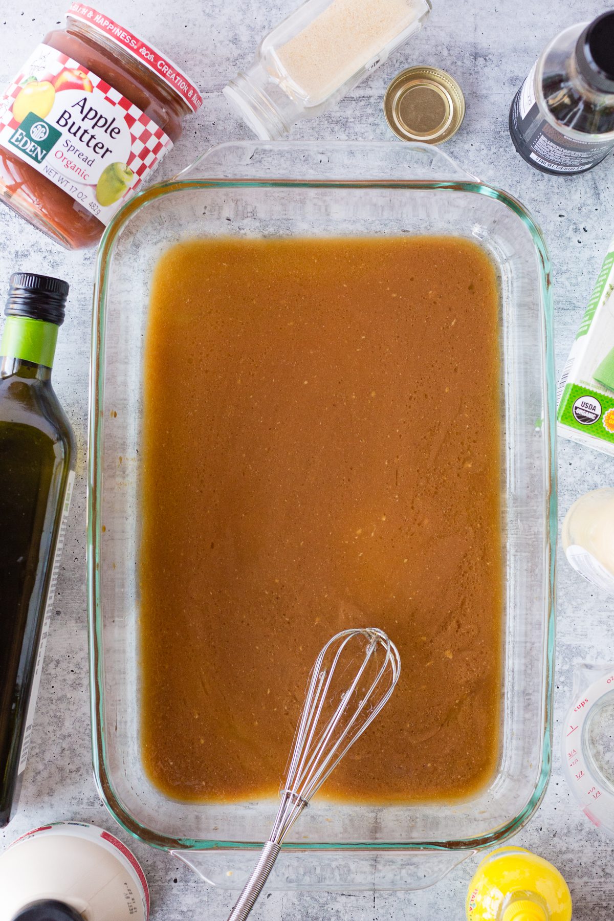 marinade in baking dish with whisker by Flora & Vino
