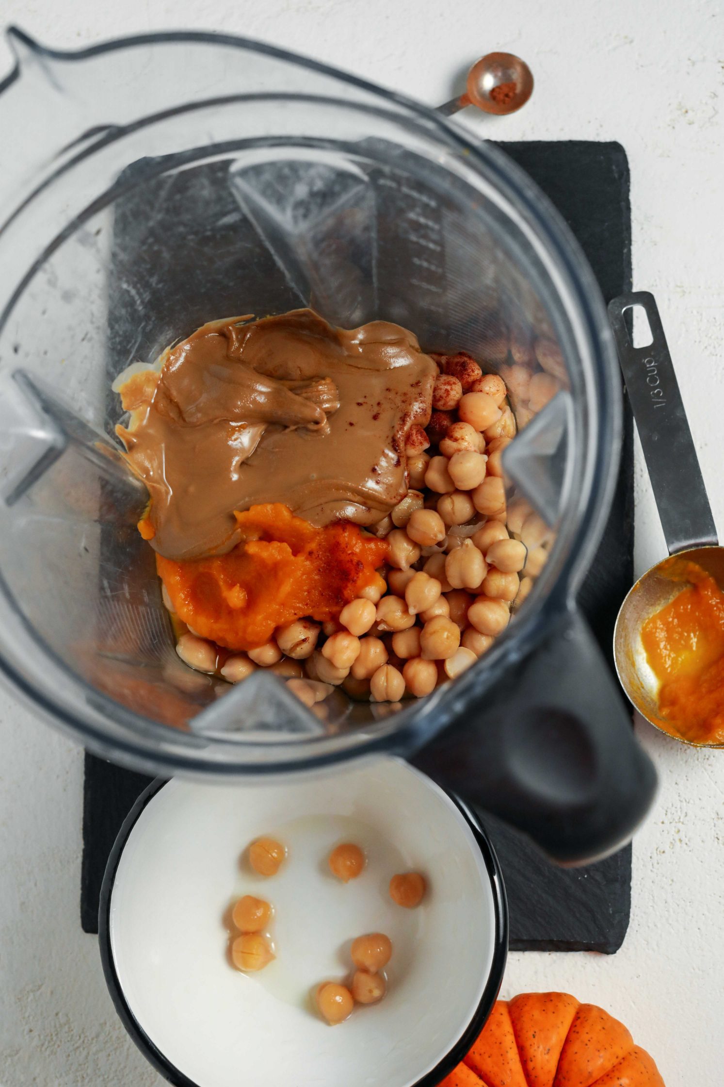 pumpkin, chickpeas, and almond butter in blender by Flora & Vino