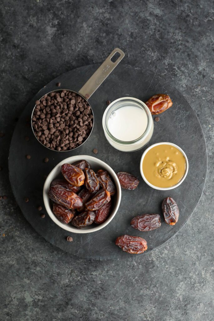 Vegan SunButter Date Caramels ingredients on wooden board by Flora & Vino