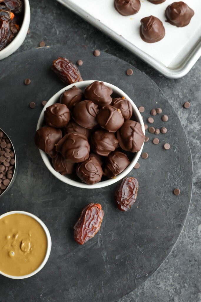 Vegan SunButter Date Caramels served in a bowl by Flora & Vino