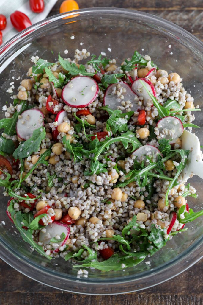 Spring Buckwheat Tabbouleh in glass bowl with spatula